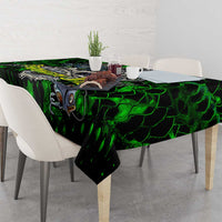 Green skull fish tablecloth draped over dining table with matching pattern