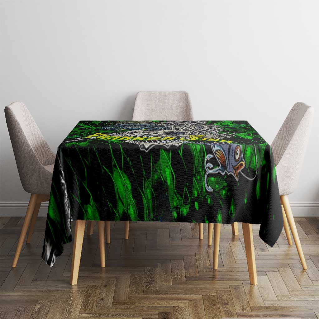 Green novelty tablecloth with skull and fish skeleton design, square table coverage