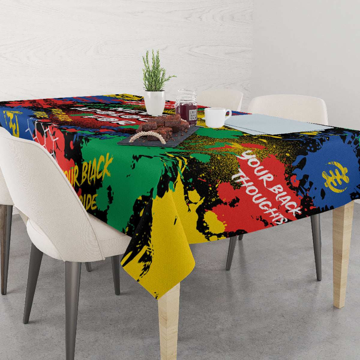 Multicolor printed tablecloth covering dining table with chairs and centerpiece