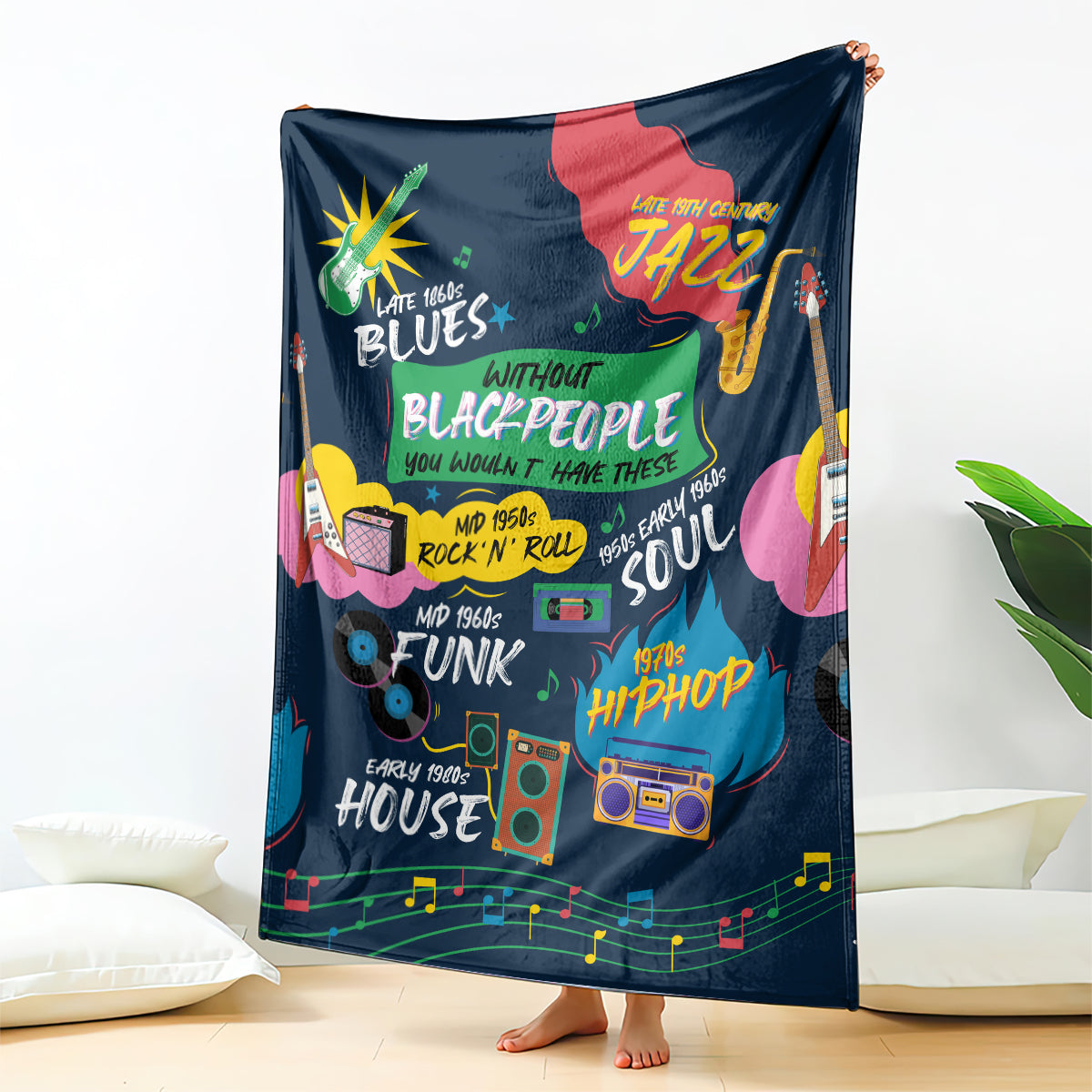 Dark blue African blanket fully spread, featuring colorful music-themed icons and text