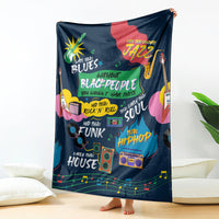 Dark blue African blanket fully spread, featuring colorful music-themed icons and text