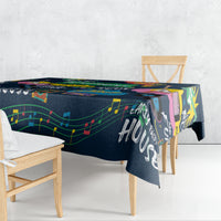 Dark blue music-print tablecloth with colorful instrument and note graphics