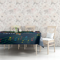 Dark blue tablecloth with colorful music notes and instruments on dining table