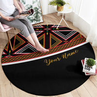 Black round African print carpet with geometric bands and custom name in yellow script