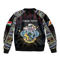 Black bomber jacket with tribal patterned sleeves and large central map graphic