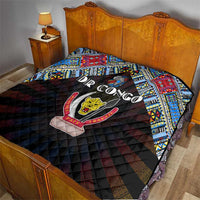 Black quilt on bed with colorful geometric border and DR Congo peace emblem patch