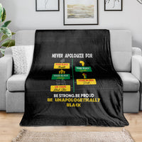 Black pride blanket on gray sofa with “Never Apologize For” and Pride graphic