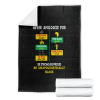 Black pride blanket folded with “Never Apologize For” text and Pride icon graphics