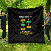 Black quilt blanket with diamond quilting and pride message typography, laid flat display