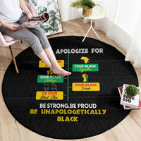 Black round African pride carpet featuring colorful text blocks and “BE UNAPOLOGETICALLY BLACK”