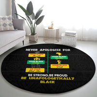 Black round carpet with central “NEVER APOLOGIZE FOR” text and pride message