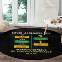 Black round carpet with colorful pride text, “BE STRONG, BE PROUD, BE UNAPOLOGETICALLY BLACK”