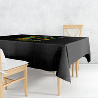 Black tablecloth draped over rectangular table