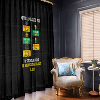 Black printed window curtain with pride text and colorful block graphics hanging by window