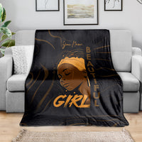 Personalized black blanket draped over sofa with gold woman portrait and “Your Name”