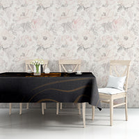 Black tablecloth with gold swirl pattern on table with floral decor