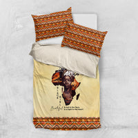 Beige bedding set with Africa portrait print and orange/black geometric border, folded shams