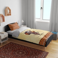 Beige bed set with Africa portrait on duvet, orange and black geometric trim and pillow shams