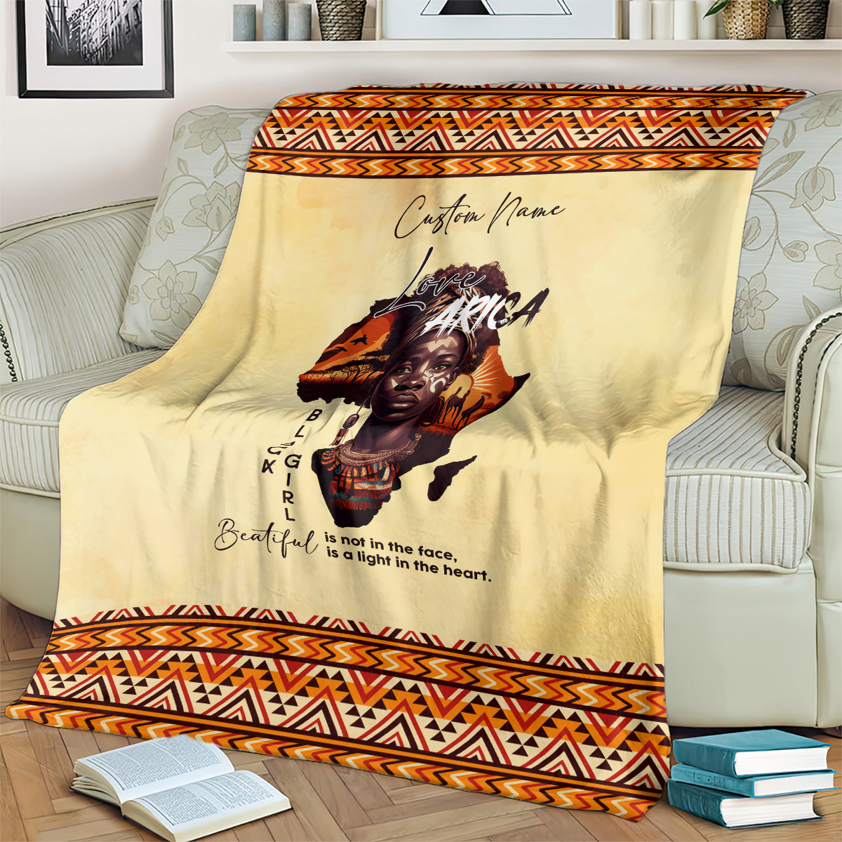 Beige Love Africa blanket with orange/black patterned edge and custom name script