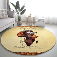 Beige round rug with Africa portrait, 'Beautiful' quote, and zigzag border edge