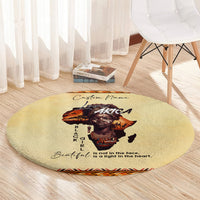 Beige round rug with Africa portrait, 'Beautiful' quote, and patterned border