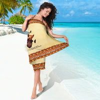 Beige sarong with orange patterned hem and central Africa portrait print