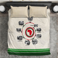 Beige duvet cover with circular African timeline graphic, green stripe hem; two matching pillows