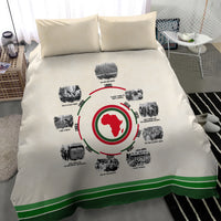 Beige duvet cover with circular African timeline print and green stripe trim; two pillows