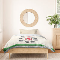Beige duvet cover with circular African timeline print and green stripe hem; two pillows