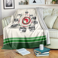 Cream history timeline blanket with red African map medallion and green bottom stripe