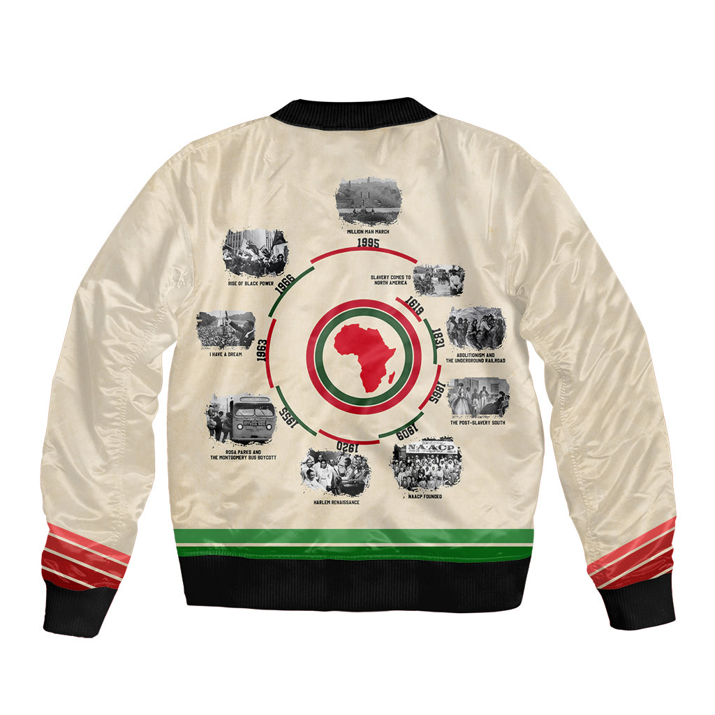 Unisex beige bomber jacket with back timeline graphic, striped ribbed hem and cuffs