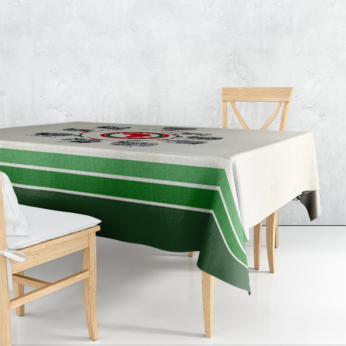 Beige tablecloth with dark green stripe bands draping over table corners