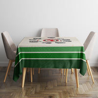 Beige tablecloth featuring green stripes and circular timeline graphic on dining table