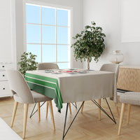 Beige tablecloth with green stripe border and central timeline graphic across tabletop