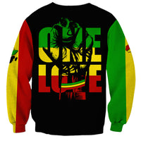Unisex black sweatshirt with reggae-style graphic on back and red yellow green sleeves