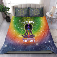Bedding set with orange-green starburst duvet and two blue-green mandala pillowcases