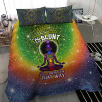 Bedding set showing green mandala duvet center with two matching pillows in blue and purple