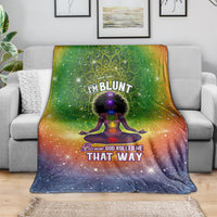 Green and navy galaxy mandala yoga graphic blanket draped on sofa, 'THAT WAY' visible