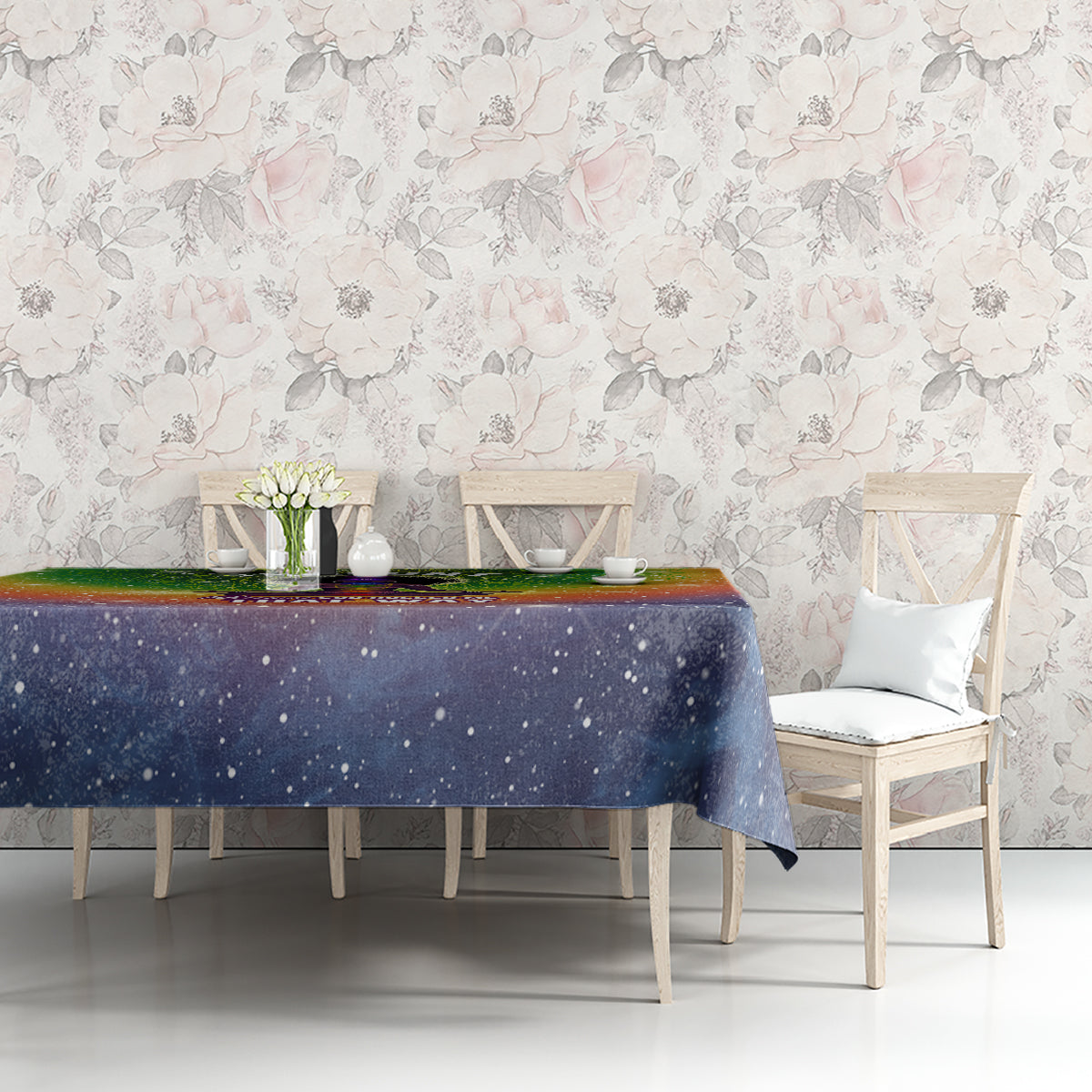 Galaxy mandala tablecloth with green top and blue starry field, shown on tabletop