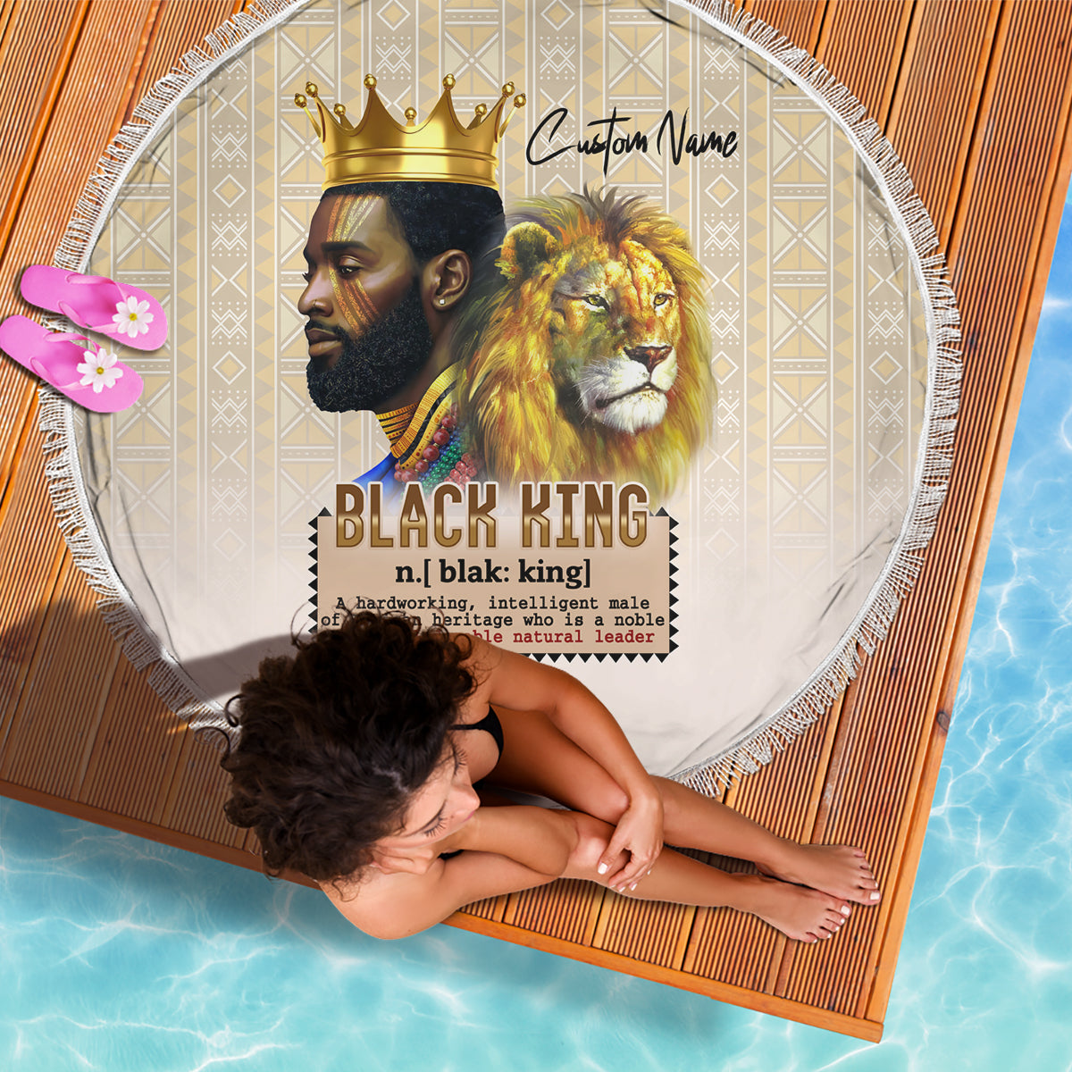 Round beige beach blanket with lion and crown graphic, fringed border