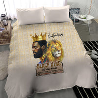 Beige king duvet close view with lion and crowned man graphic over gold lattice pattern