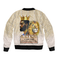 Unisex beige bomber jacket, black ribbed hem and cuffs, lion and crown graphic on back