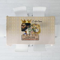 Beige tablecloth with gold geometric pattern border and central king portrait print