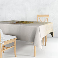 Beige tablecloth draped on rectangular table with matching skirt and corner fall