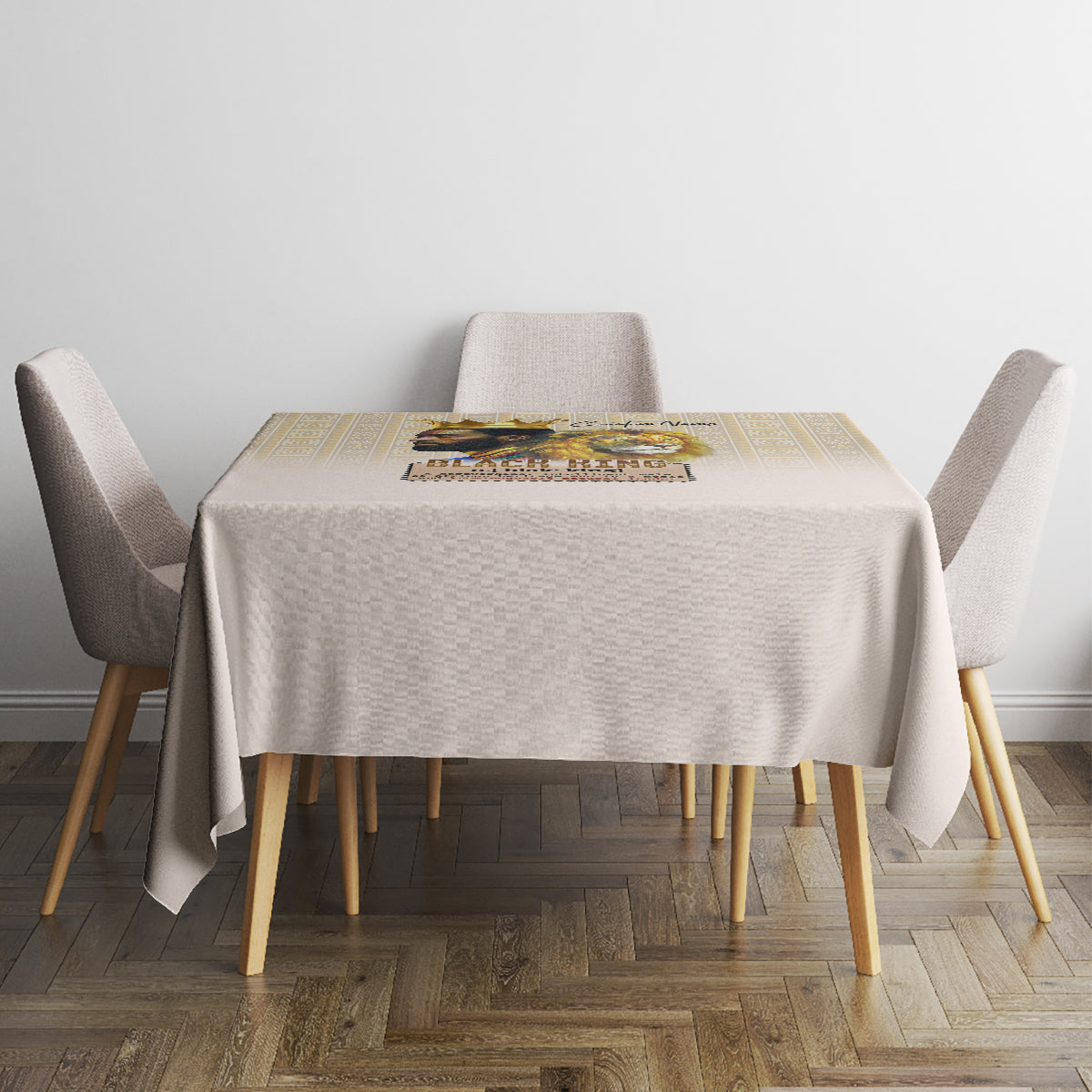 Beige tablecloth on square table with gold geometric border and centerpiece on top