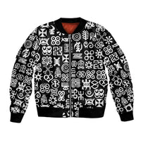 Black bomber jacket with white Adinkra-style geometric pattern, ribbed cuffs and hem