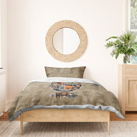 Beige bedding set with cartoon character face collage on duvet and one pillow.