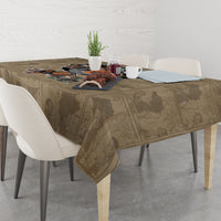 Beige tablecloth with printed African portrait artwork over a dining table