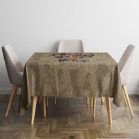 Beige round-top tablecloth with African portrait collage print, set with chairs
