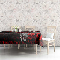 Red and black Viking warrior tablecloth on dining table with two white chairs